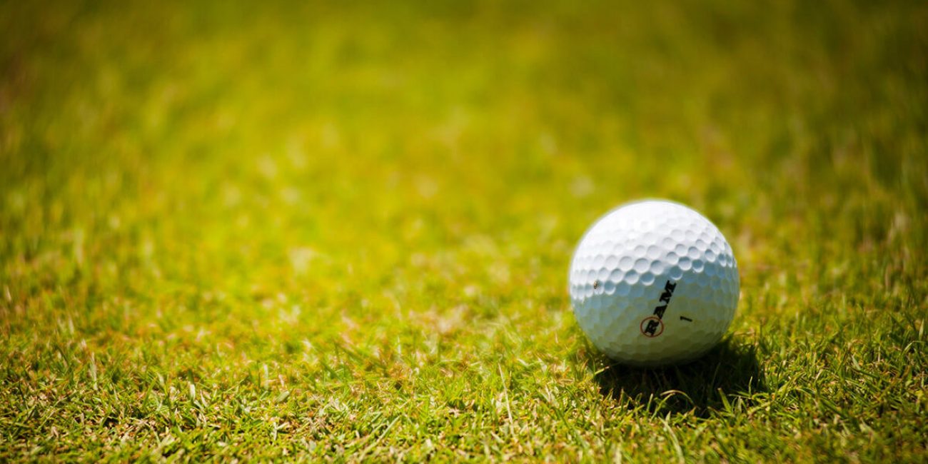 white-golf-ball-on-green-grass-1174996-1200x600